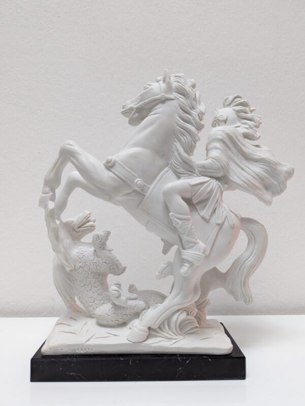 Statue of St. George on horseback in white marble dust